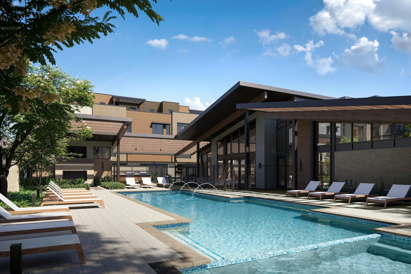 The Atavia clubhouse features a modern pool, lounge chairs, and sleek glass architecture, surrounded by greenery under a bright blue sky.